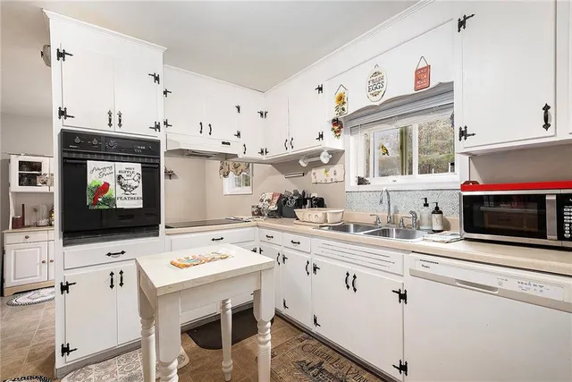 a bathroom with a toilet a sink and a mirror