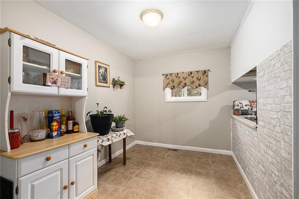 1246 Duncan Bridge Road Cornelia, GA 30531 - Photo 8 of 21 a kitchen with a cabinets and window