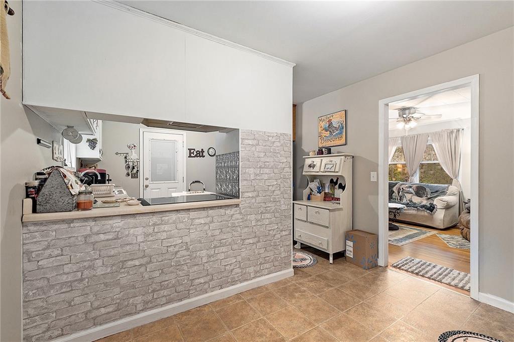 1246 Duncan Bridge Road Cornelia, GA 30531 - Photo 9 of 21 a view of a living room and bedroom
