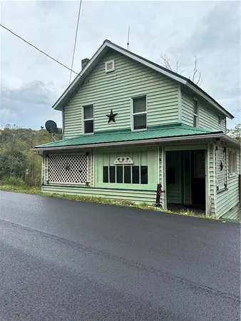 a front view of a house with garage