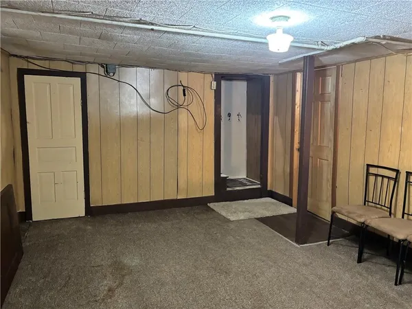 a view of an empty room with a fireplace