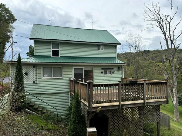 a view of balcony with wooden floor