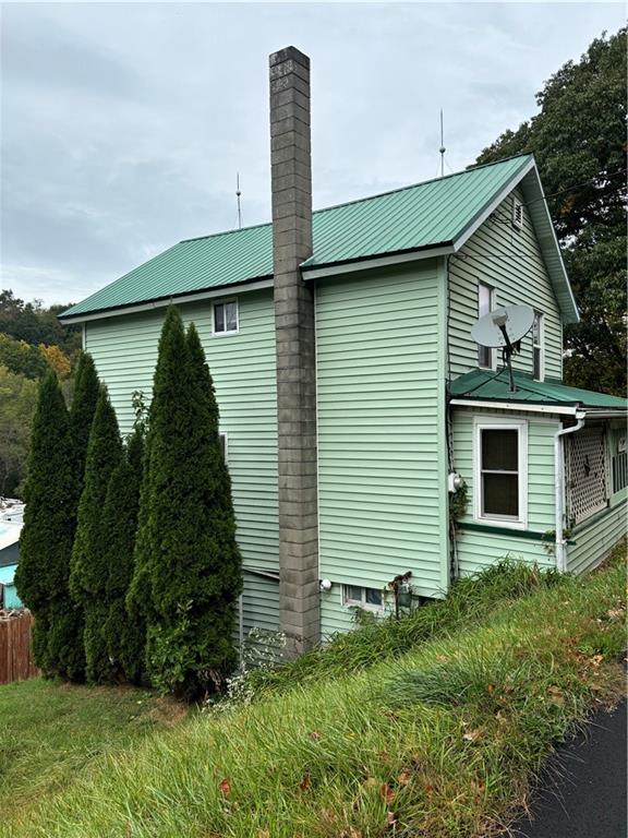 397 Purchase Line Road Dixonville, PA 15734 - Photo 23 of 24 a front view of a house with garden