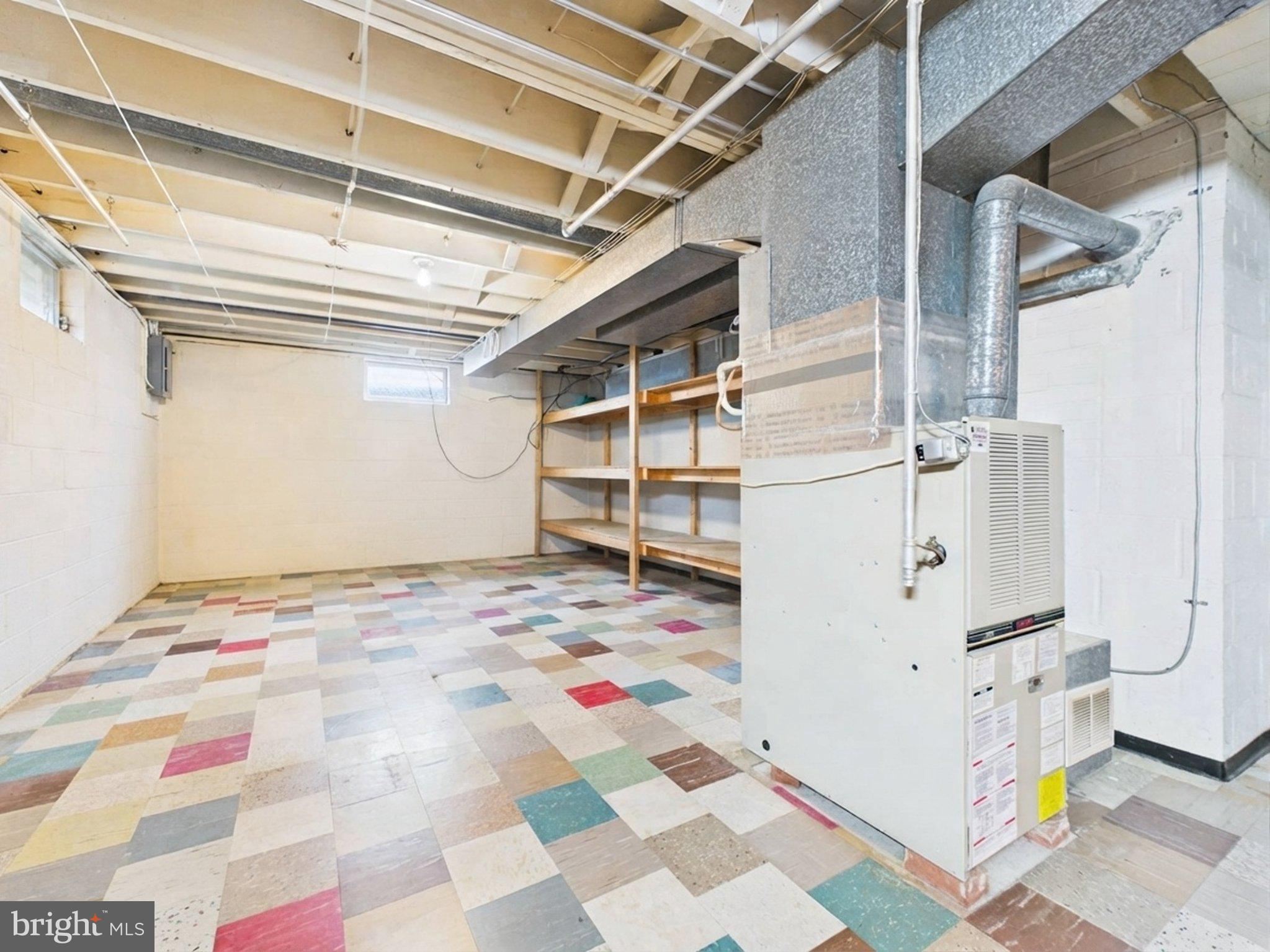347 George Street Hanover, PA 17331 - Photo 39 of 42 Spacious basement with colorful flooring.