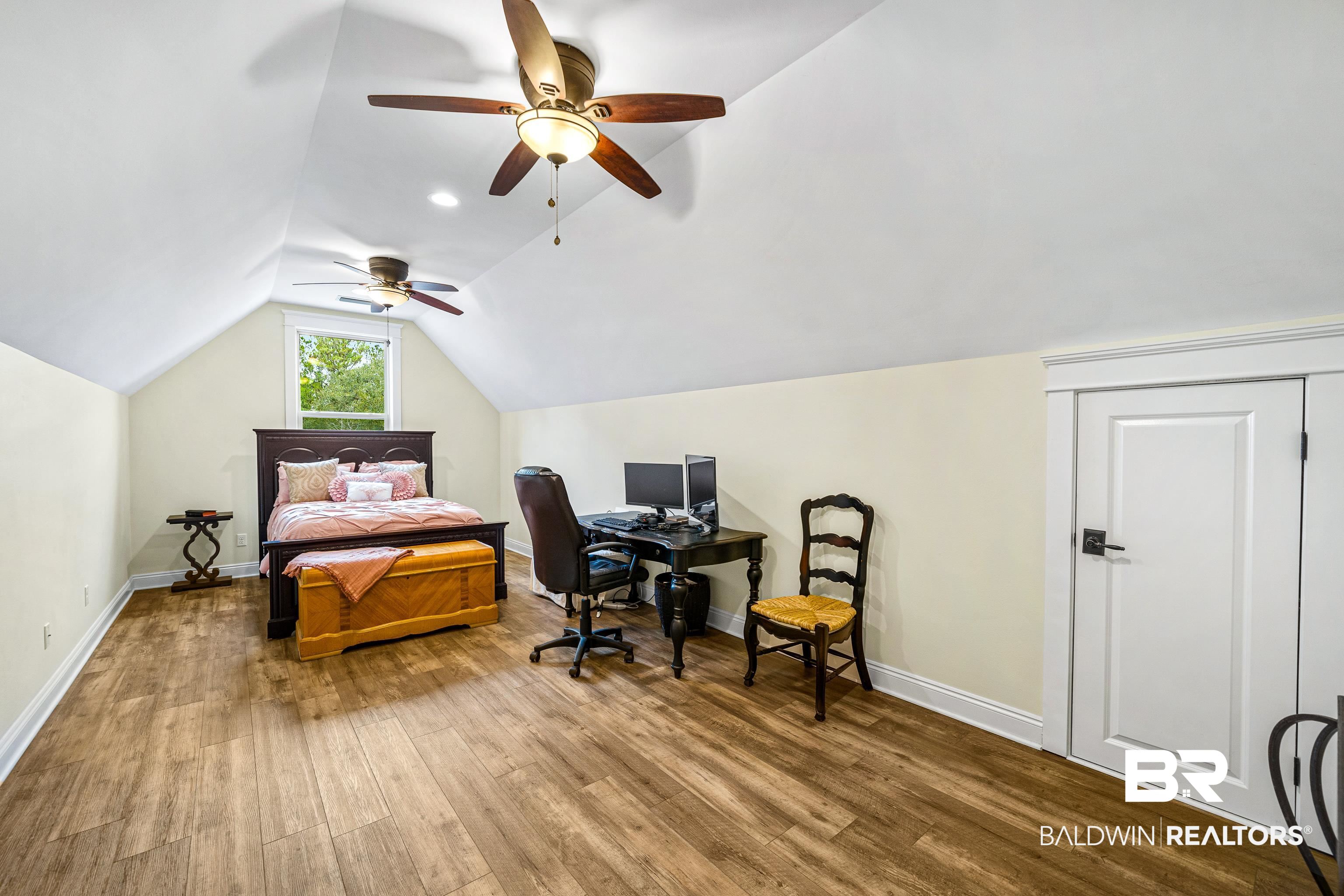 36784 Legacy Way Bay Minette, AL 36507 - Photo 41 of 57 Upper level bonus room with wood-style flooring, ceiling fan, vaulted ceiling and attic access.