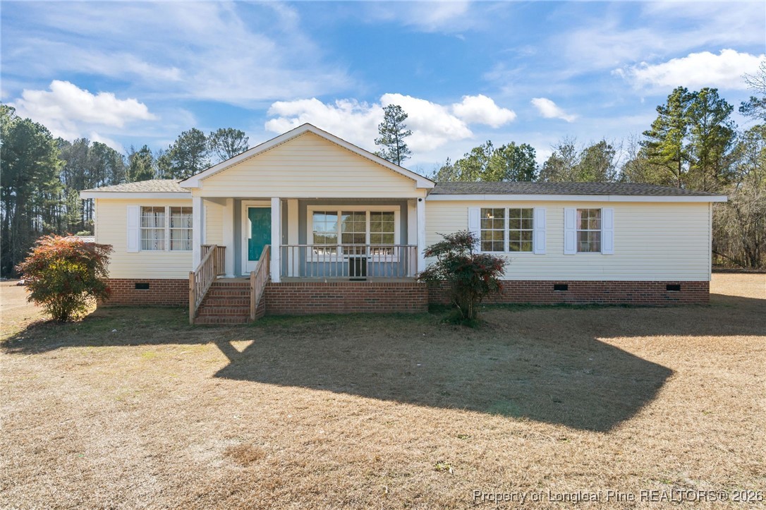 26261 Beaver Run Wagram, NC 28396 - Photo 1 of 50 a view of a house with a yard