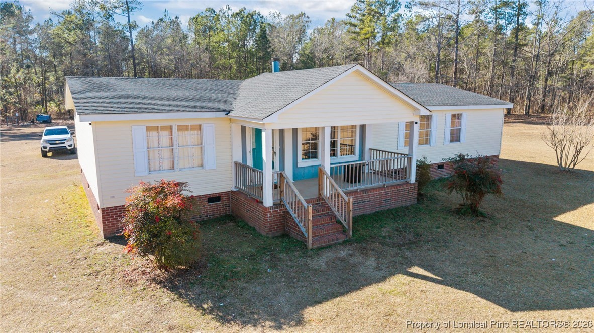 26261 Beaver Run Wagram, NC 28396 - Photo 12 of 50 a view of a house with a yard