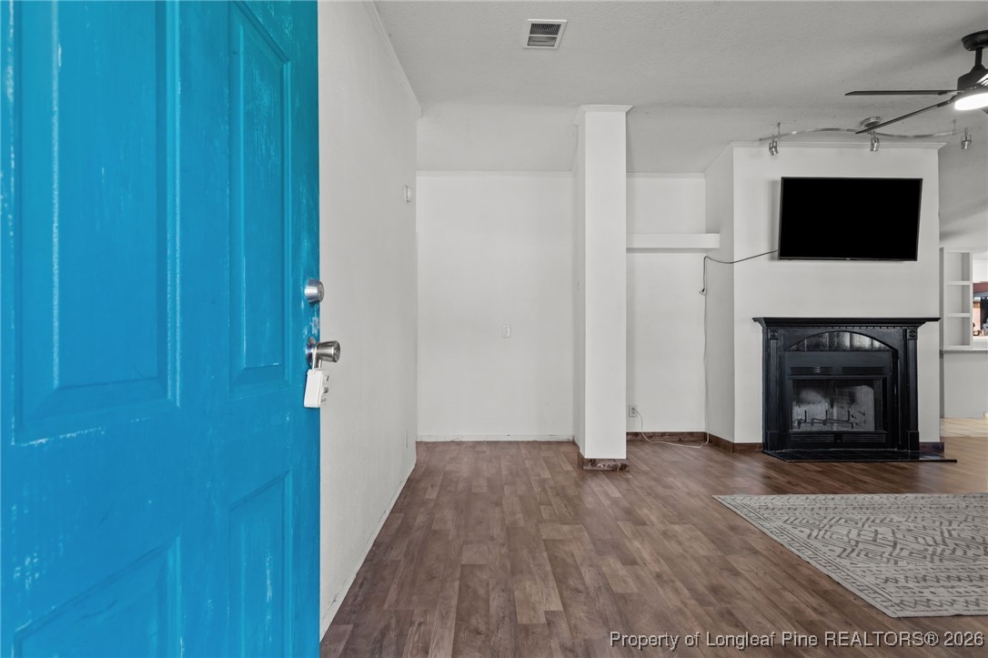26261 Beaver Run Wagram, NC 28396 - Photo 13 of 50 a view of a livingroom with an empty space and a fireplace