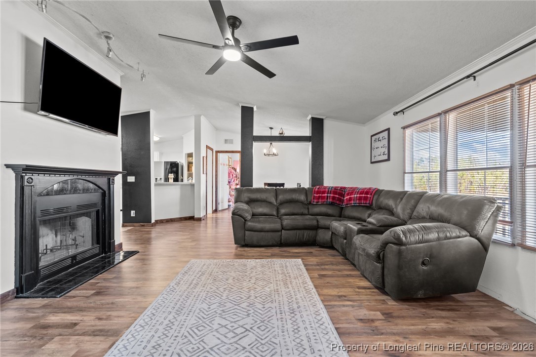 26261 Beaver Run Wagram, NC 28396 - Photo 15 of 50 a living room with furniture and a fireplace