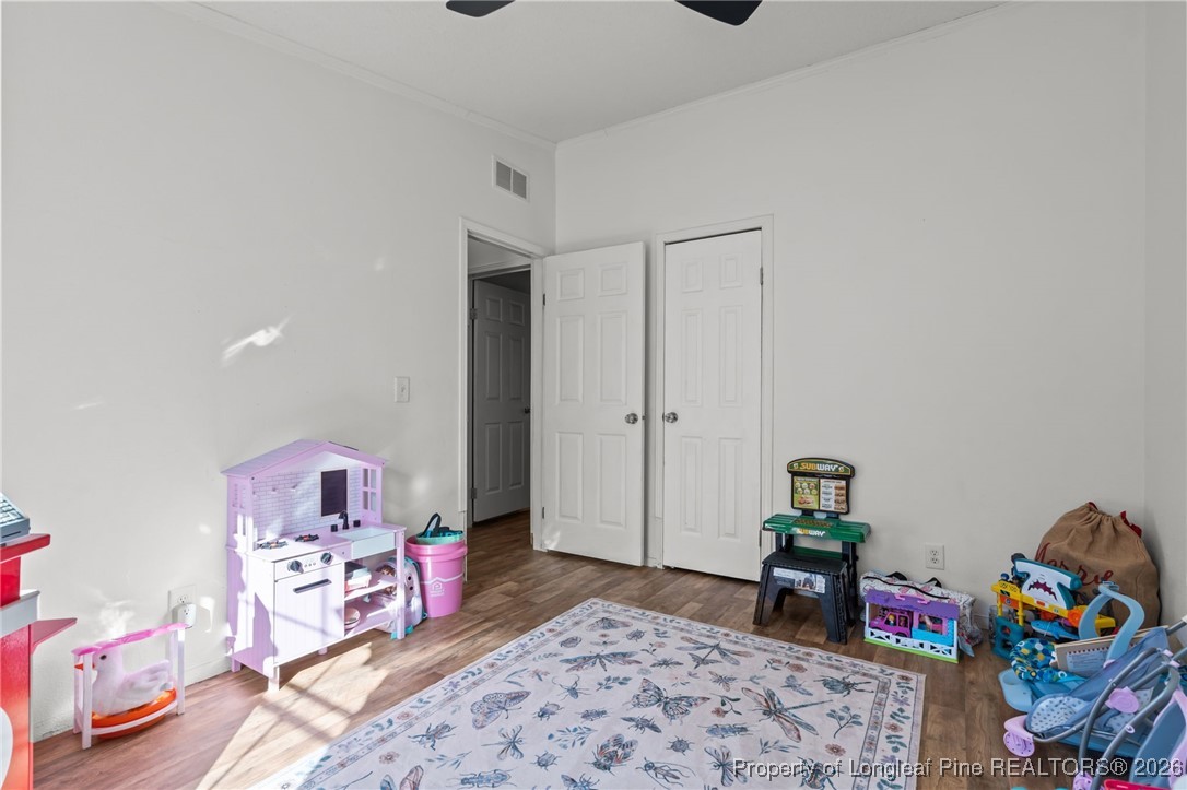 26261 Beaver Run Wagram, NC 28396 - Photo 22 of 50 a bedroom with furniture and a rug