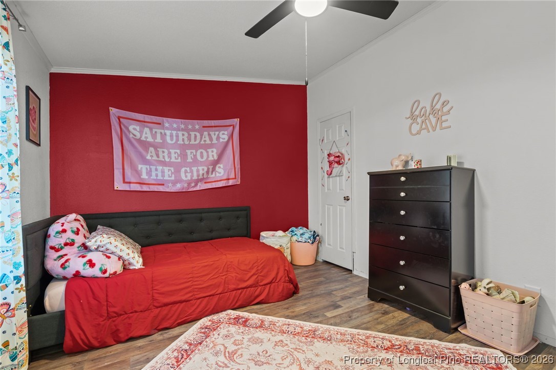 26261 Beaver Run Wagram, NC 28396 - Photo 24 of 50 a bedroom with a bed and a dresser
