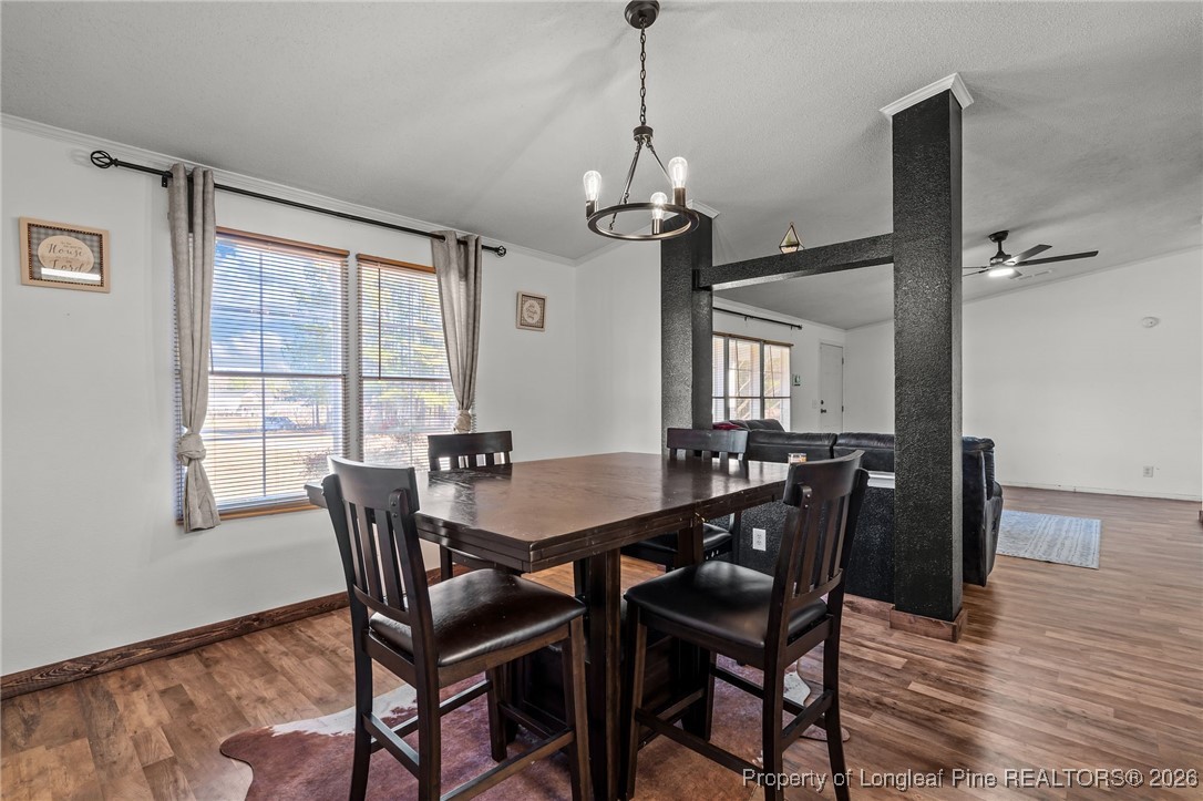 26261 Beaver Run Wagram, NC 28396 - Photo 26 of 50 a view of a dining room with furniture window and wooden floor