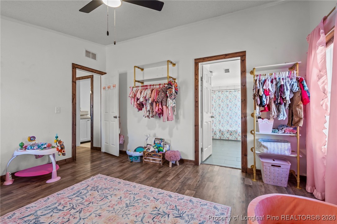 26261 Beaver Run Wagram, NC 28396 - Photo 29 of 50 a bedroom with furniture and wooden floor