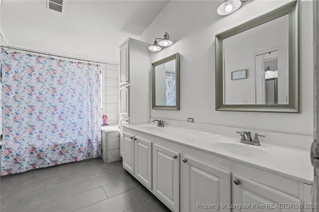 a kitchen with a sink cabinets and stainless steel appliances