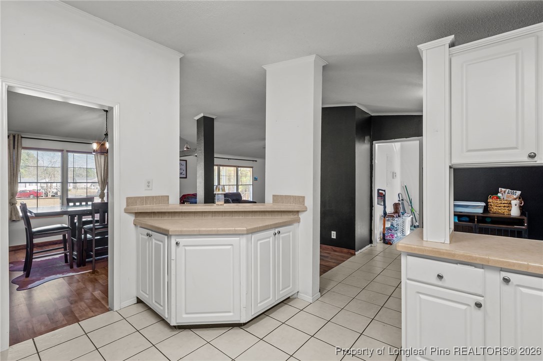 26261 Beaver Run Wagram, NC 28396 - Photo 34 of 50 a kitchen with granite countertop white cabinets and appliances