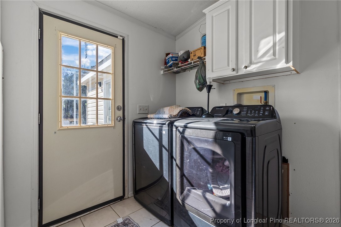 26261 Beaver Run Wagram, NC 28396 - Photo 38 of 50 a utility room with stainless steel appliances granite countertop a stove a washer and dryer