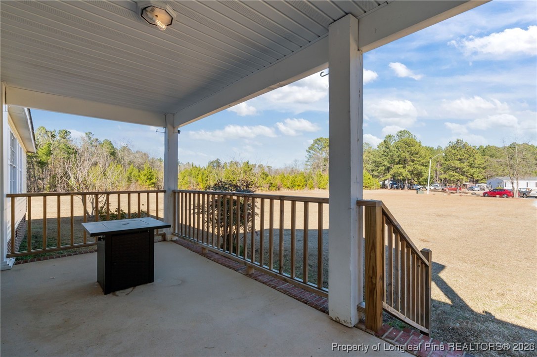 26261 Beaver Run Wagram, NC 28396 - Photo 39 of 50 a view of balcony with furniture