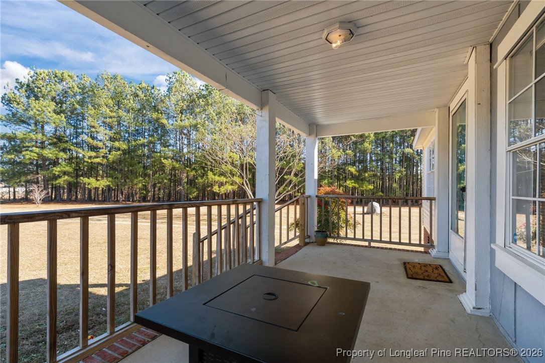 26261 Beaver Run Wagram, NC 28396 - Photo 41 of 50 a balcony with wooden floor