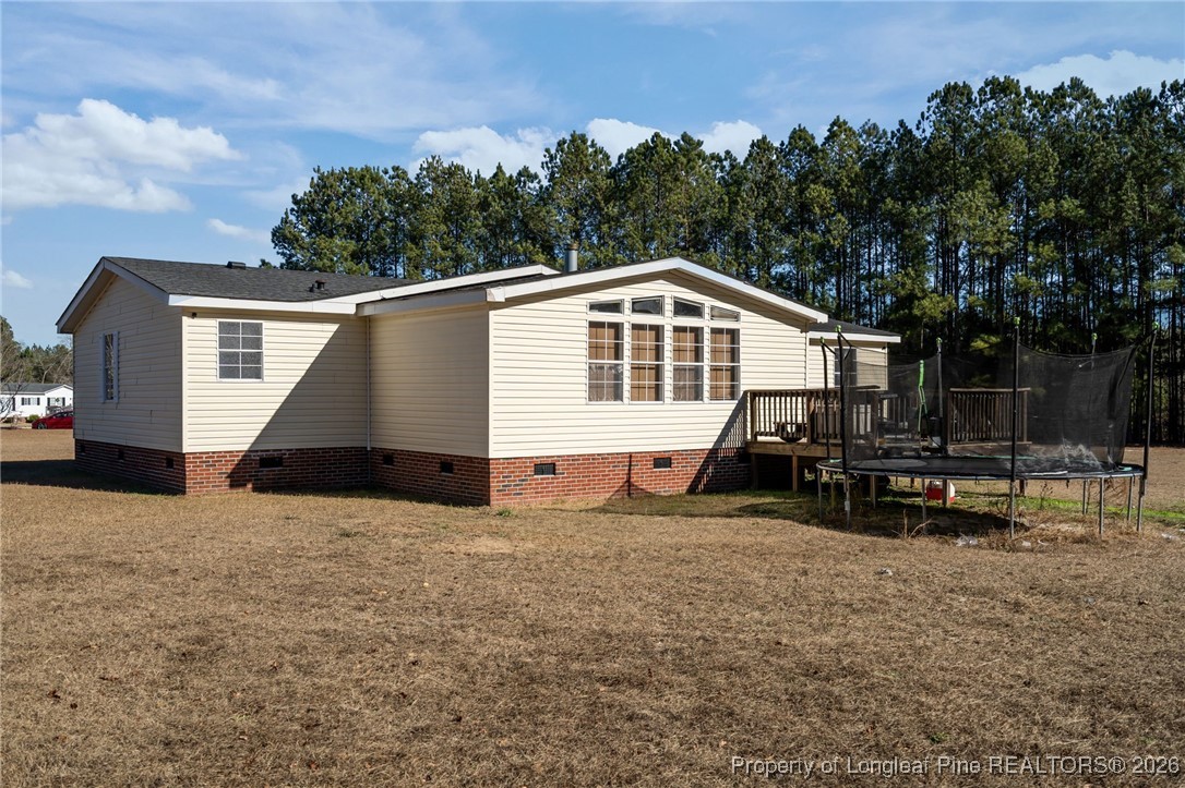 26261 Beaver Run Wagram, NC 28396 - Photo 44 of 50 a view of a house with a patio