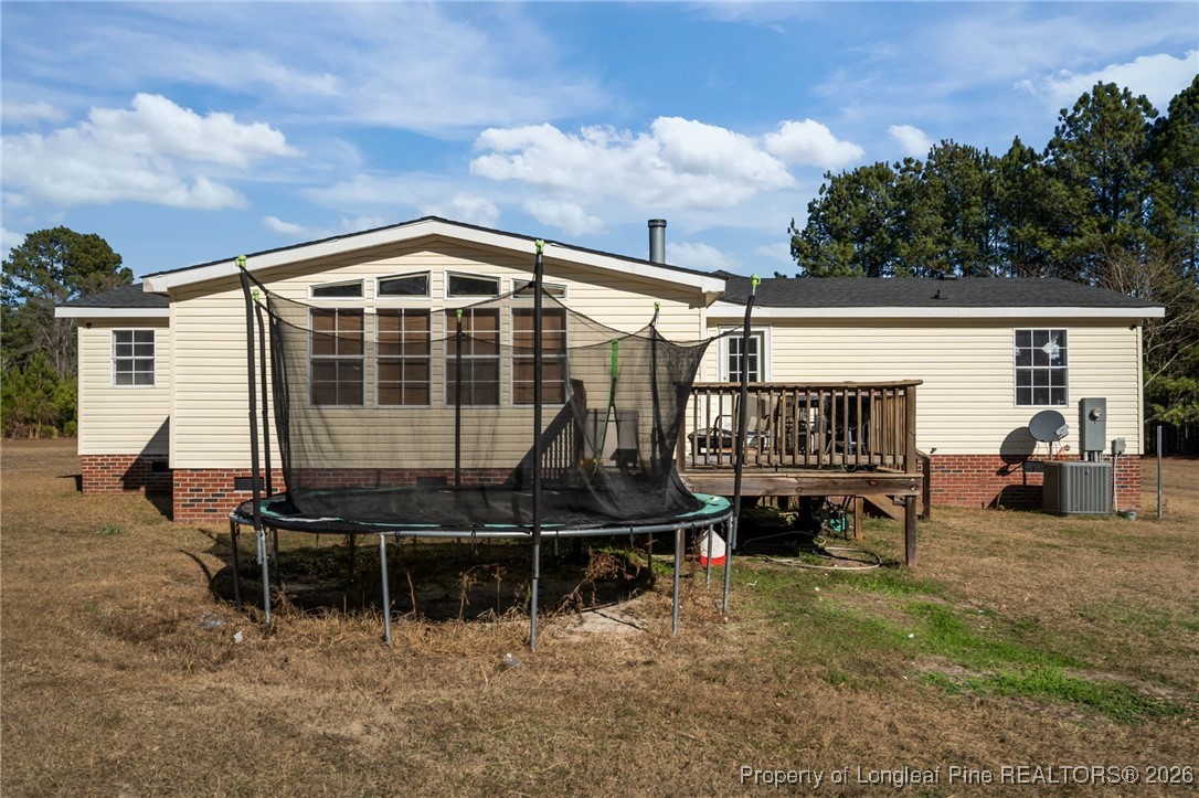 26261 Beaver Run Wagram, NC 28396 - Photo 45 of 50 a view of a house with backyard and sitting area