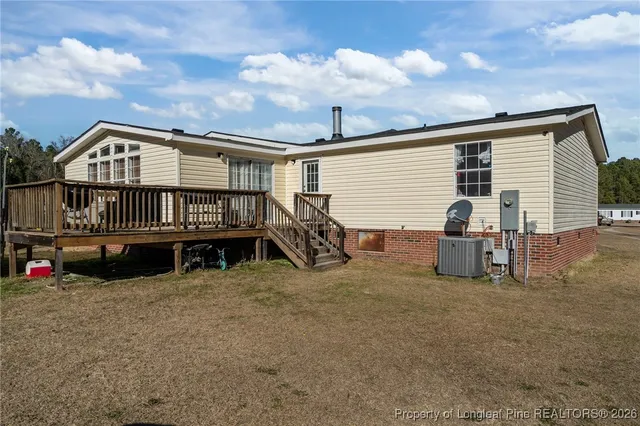 a view of roof deck with patio