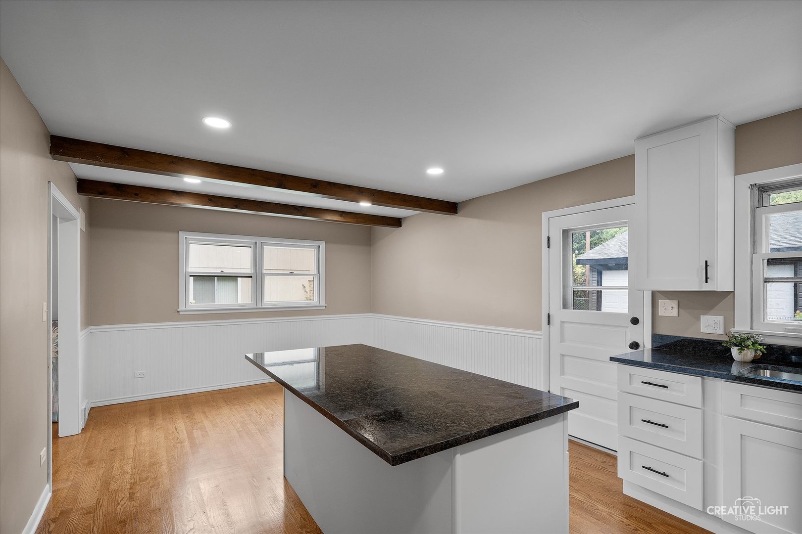 4-n045 Wiant Road West Chicago, IL 60185 - Photo 9 of 27 a kitchen with stainless steel appliances granite countertop a sink dishwasher and a stove with wooden floor