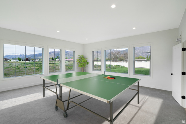1952 South Comanche Circle Farmington, UT 84025 - Photo 41 of 52 Game room with a mountain view, carpet, plenty of natural light, and recessed lighting