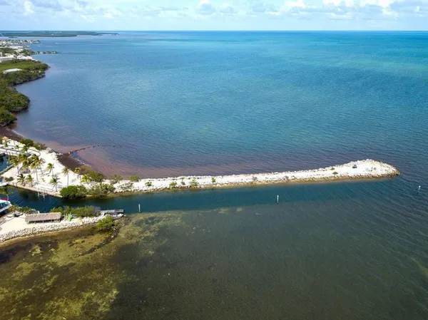 a view of a swimming pool with outdoor seating