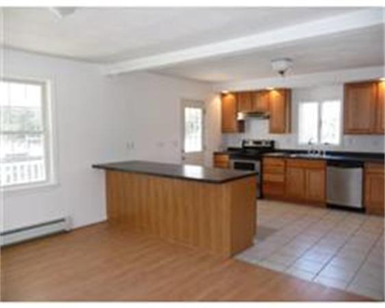 1215 Petersham Road Athol, MA 01331 - Photo 4 of 9 a kitchen with stainless steel appliances granite countertop a stove a sink a granite counter tops and a window