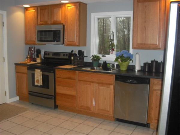 1215 Petersham Road Athol, MA 01331 - Photo 5 of 9 a kitchen with stainless steel appliances granite countertop a stove a sink and a microwave