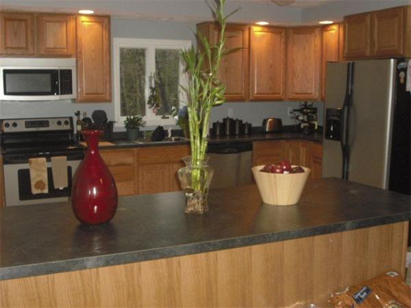 1215 Petersham Road Athol, MA 01331 - Photo 7 of 9 a kitchen with a sink a counter and cabinets