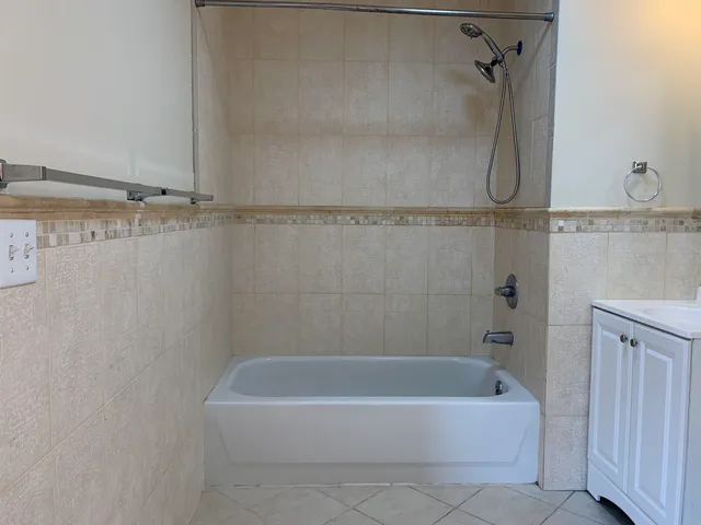 a bathroom with a bath tub