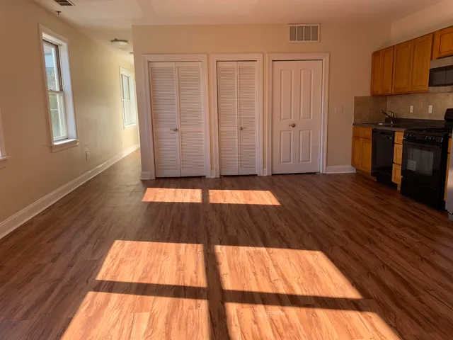 a view of wooden floor in an empty room