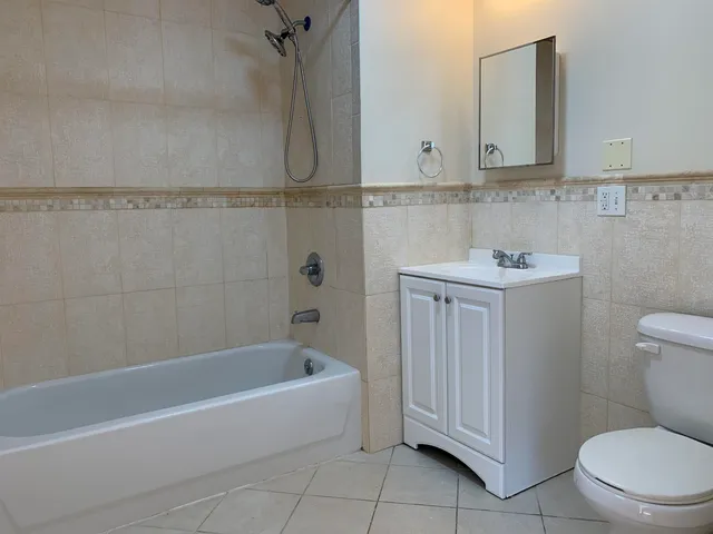a bathroom with a sink a toilet and bathtub