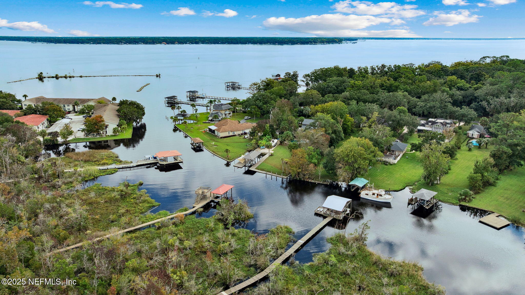 2245 Reed Street Orange Park, FL 32073 - Photo 103 of 107 an aerial view of a house with a lake view