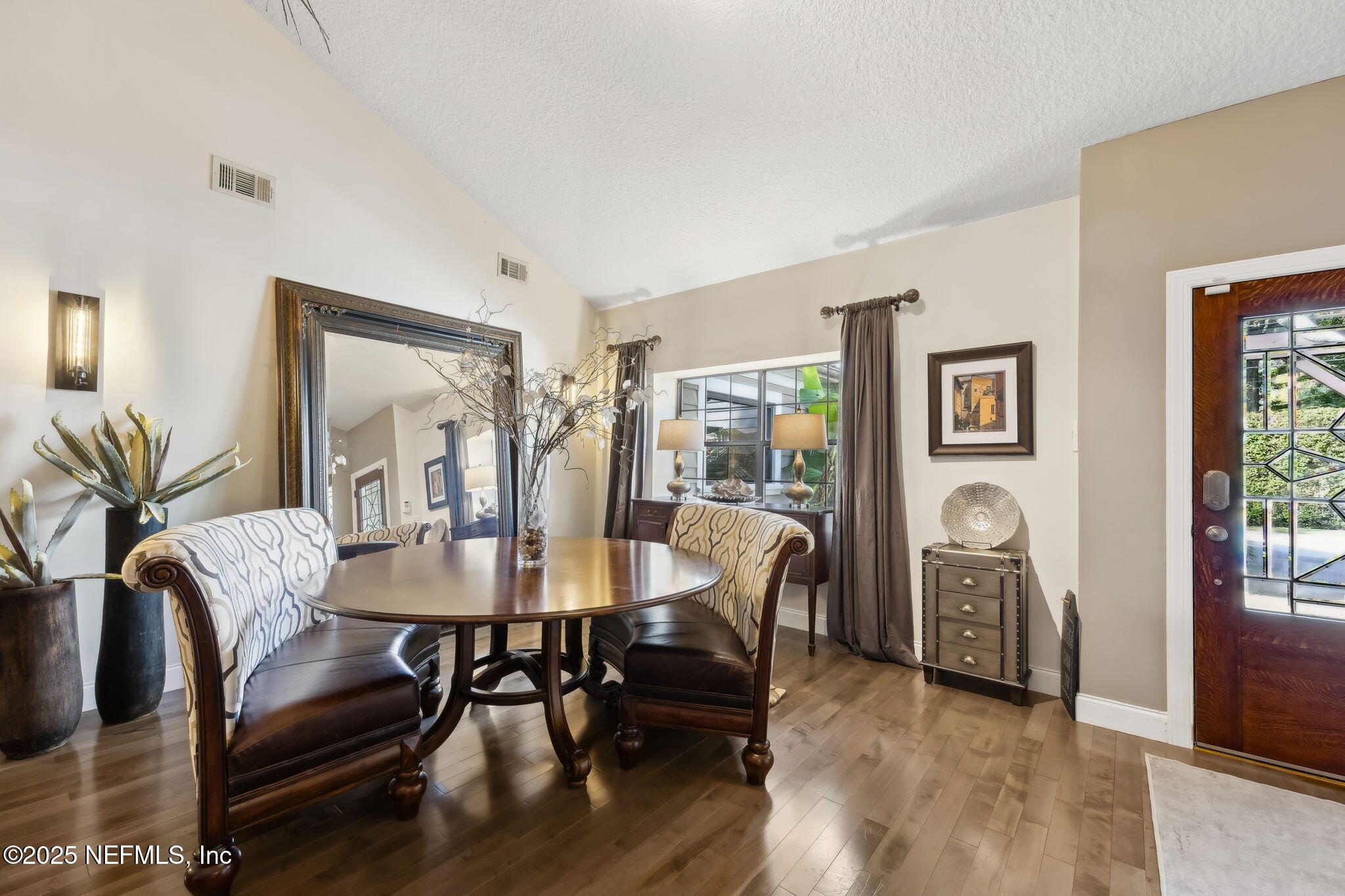 2245 Reed Street Orange Park, FL 32073 - Photo 12 of 107 a view of a a dining room with furniture window and wooden floor