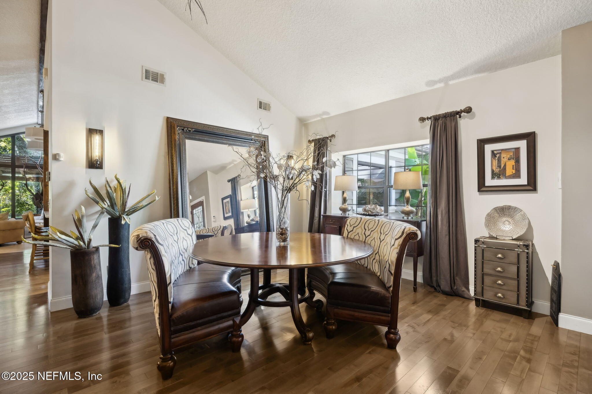2245 Reed Street Orange Park, FL 32073 - Photo 14 of 107 a view of a dining room with furniture and wooden floor