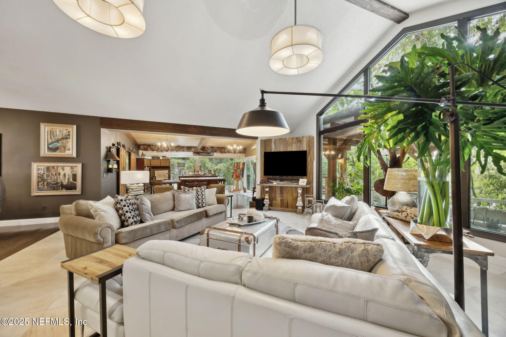 2245 Reed Street Orange Park, FL 32073 - Photo 19 of 107 a living room with furniture a floor to ceiling window and a large window