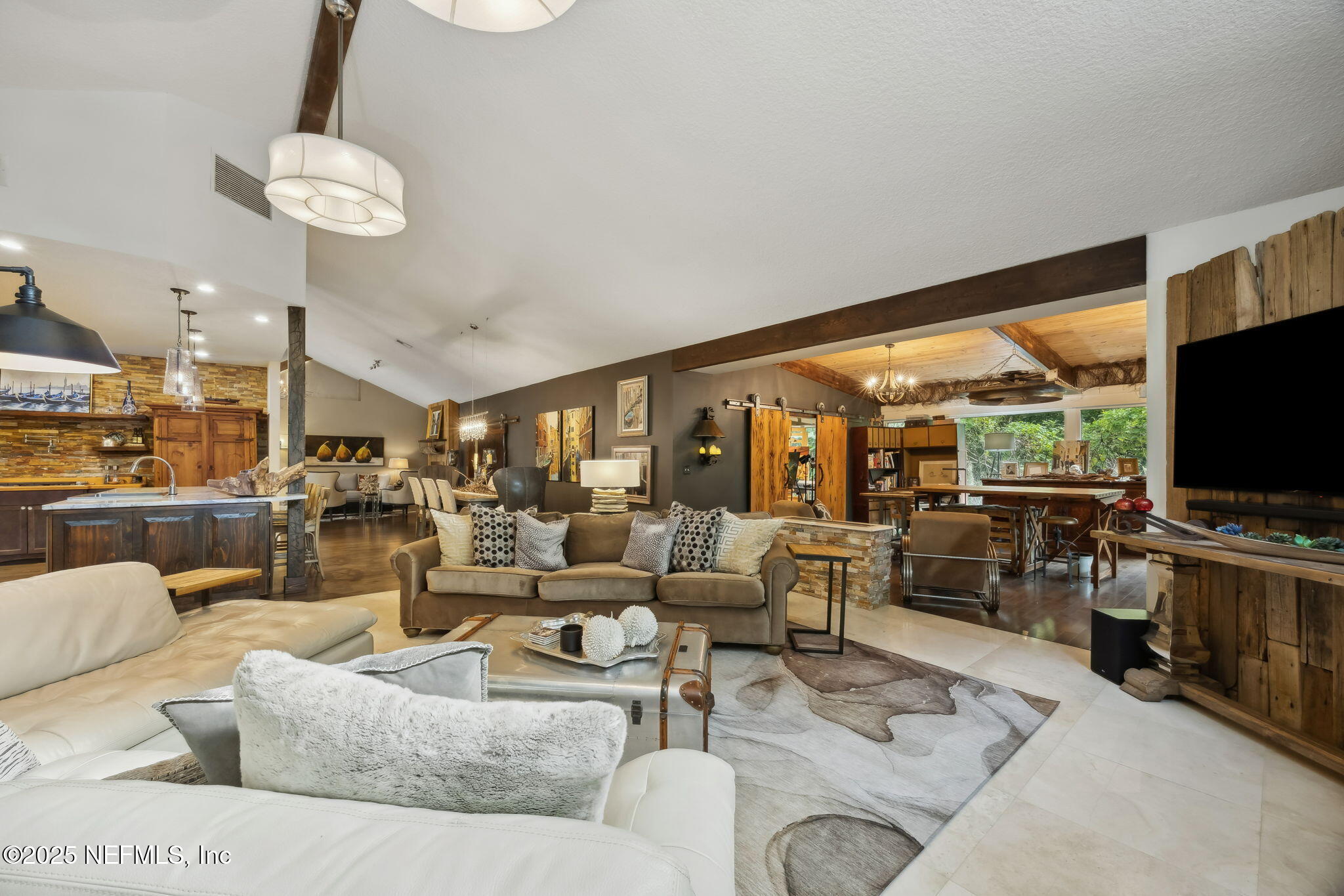 2245 Reed Street Orange Park, FL 32073 - Photo 20 of 107 a living room with furniture and a flat screen tv