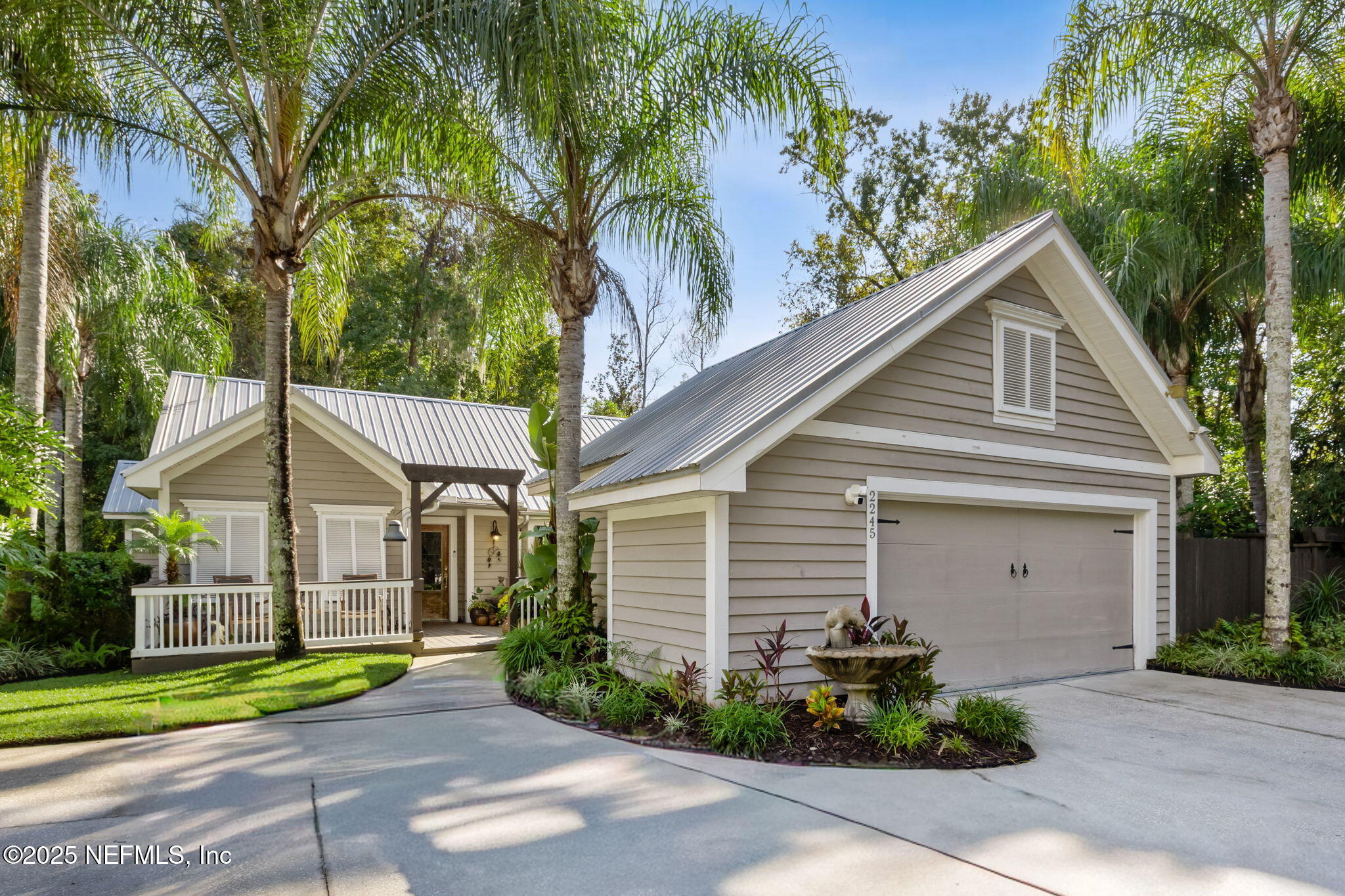 2245 Reed Street Orange Park, FL 32073 - Photo 2 of 107 a front view of a house with garden