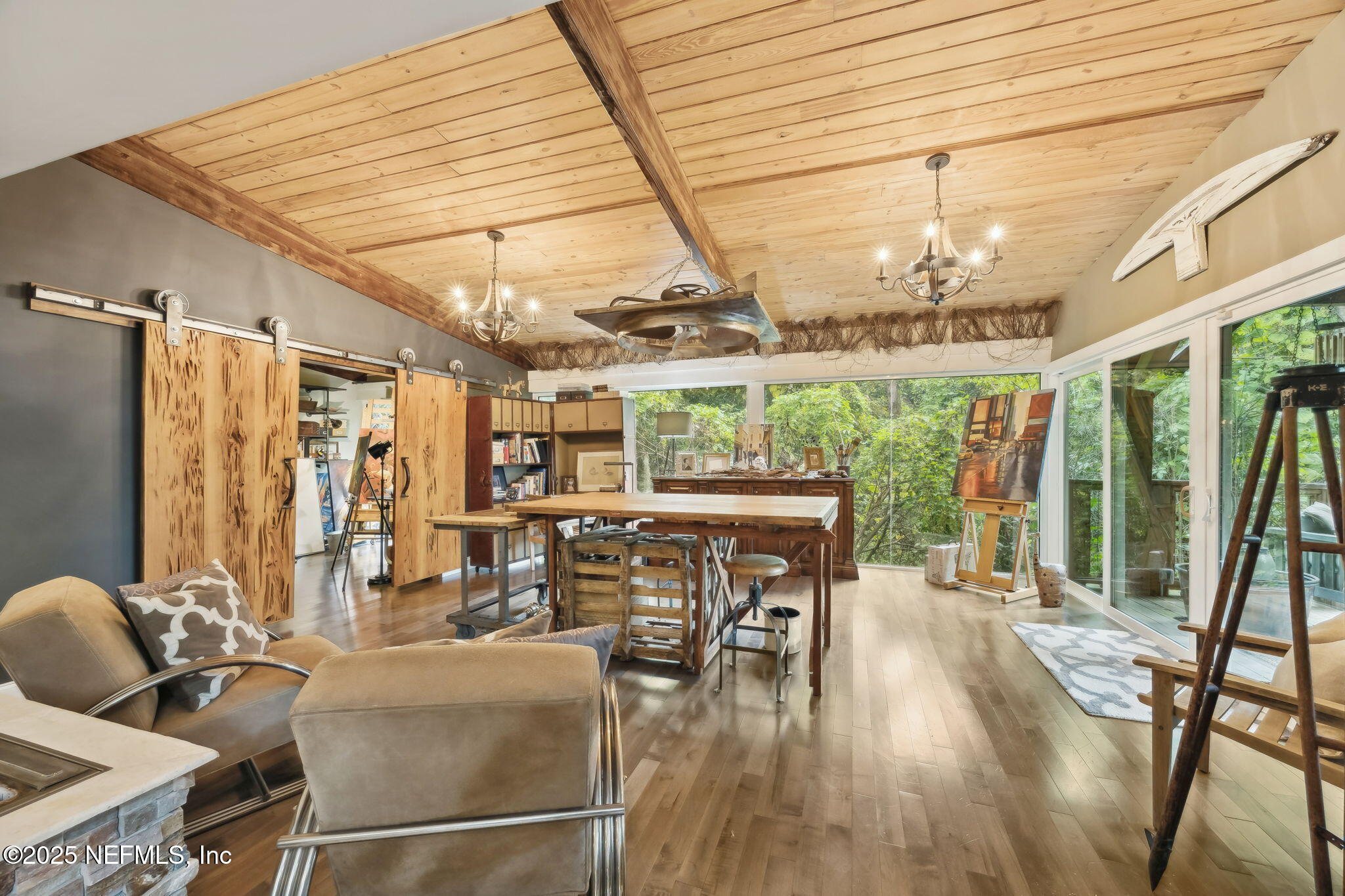 2245 Reed Street Orange Park, FL 32073 - Photo 23 of 107 a dining room with furniture a chandelier and wooden floor