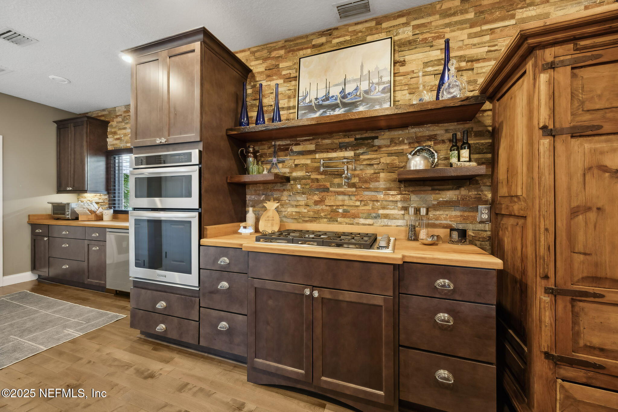 2245 Reed Street Orange Park, FL 32073 - Photo 28 of 107 a kitchen with stainless steel appliances granite countertop a refrigerator and a stove
