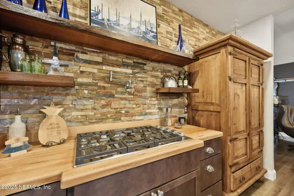 a bathroom with a granite countertop sink a mirror and a shower