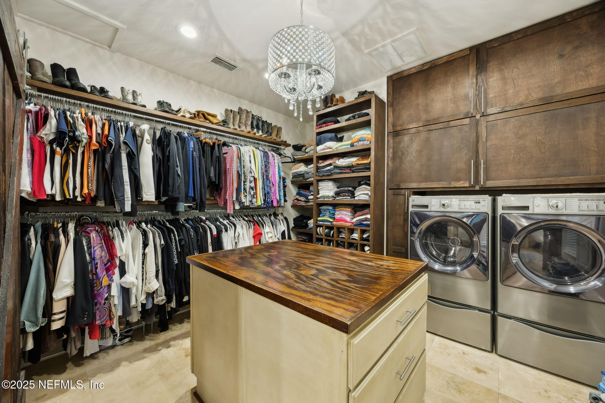 2245 Reed Street Orange Park, FL 32073 - Photo 42 of 107 a view of walk in closet with clothes and shoes
