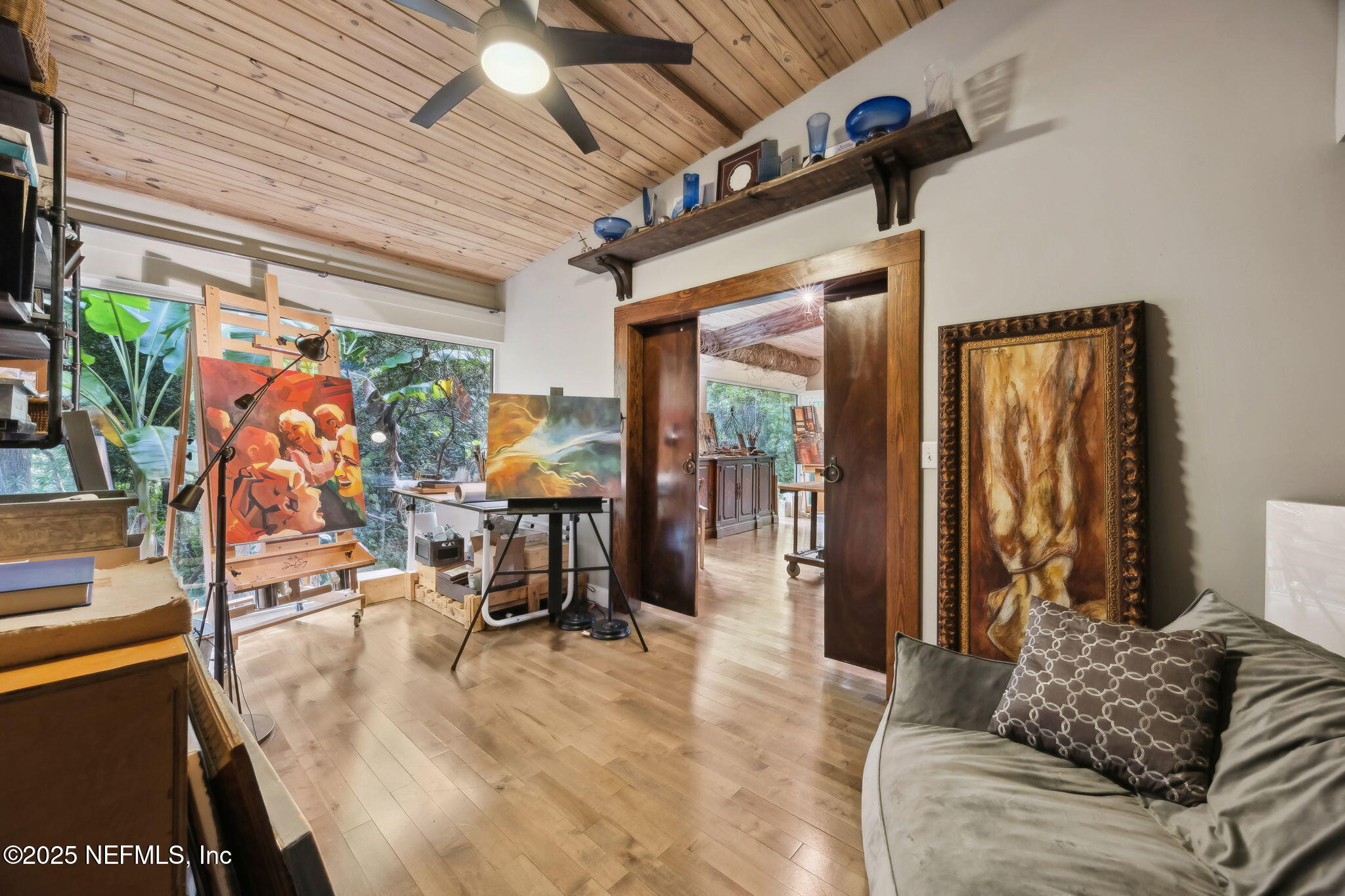 2245 Reed Street Orange Park, FL 32073 - Photo 44 of 107 a living room with furniture and a flat screen tv