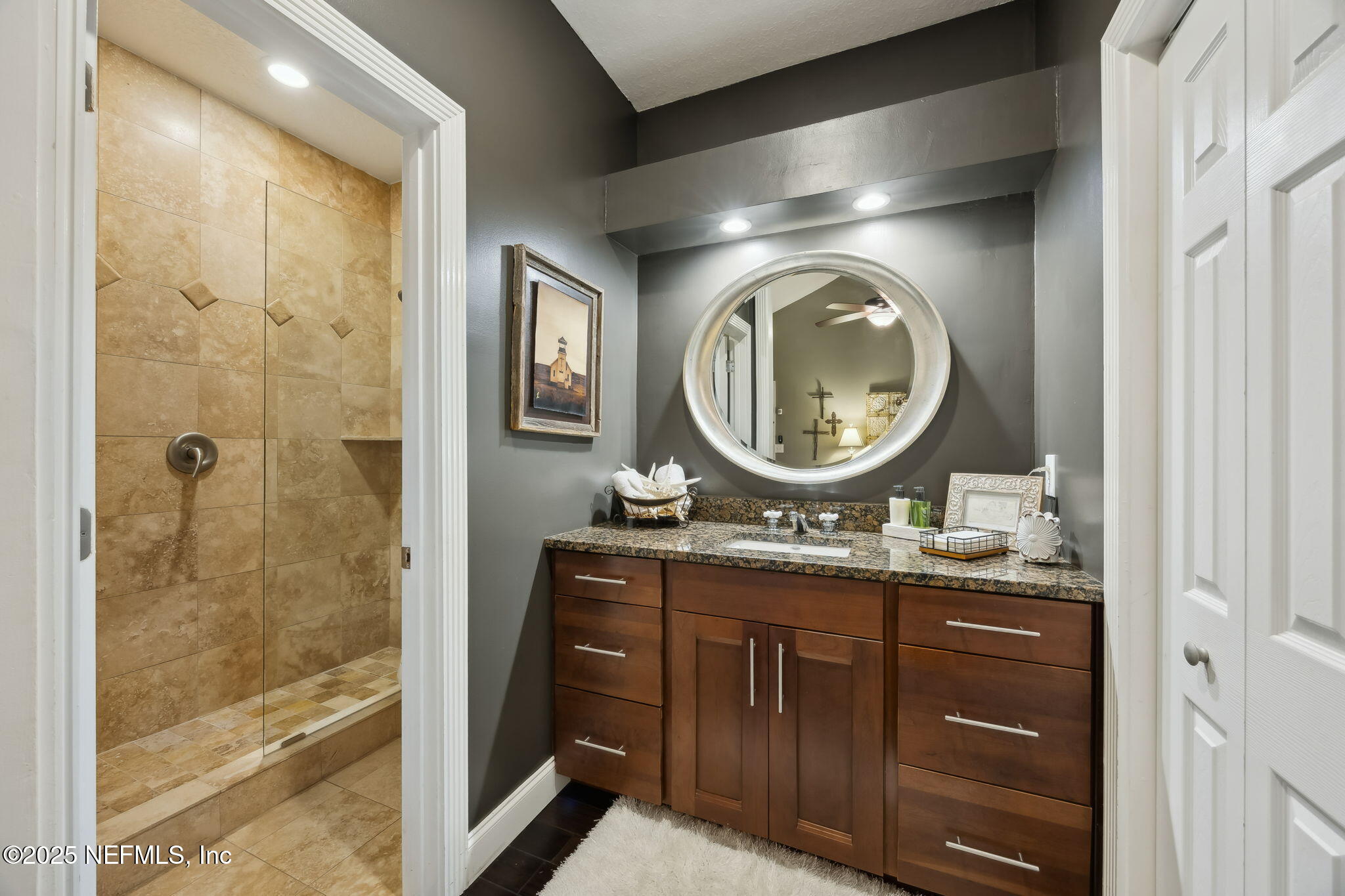 2245 Reed Street Orange Park, FL 32073 - Photo 52 of 107 a bathroom with a granite countertop sink a mirror and a shower