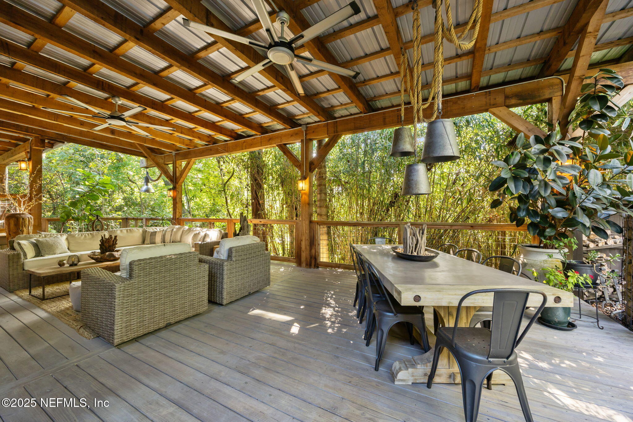 2245 Reed Street Orange Park, FL 32073 - Photo 59 of 107 a view of a patio with table and chairs and wooden floor