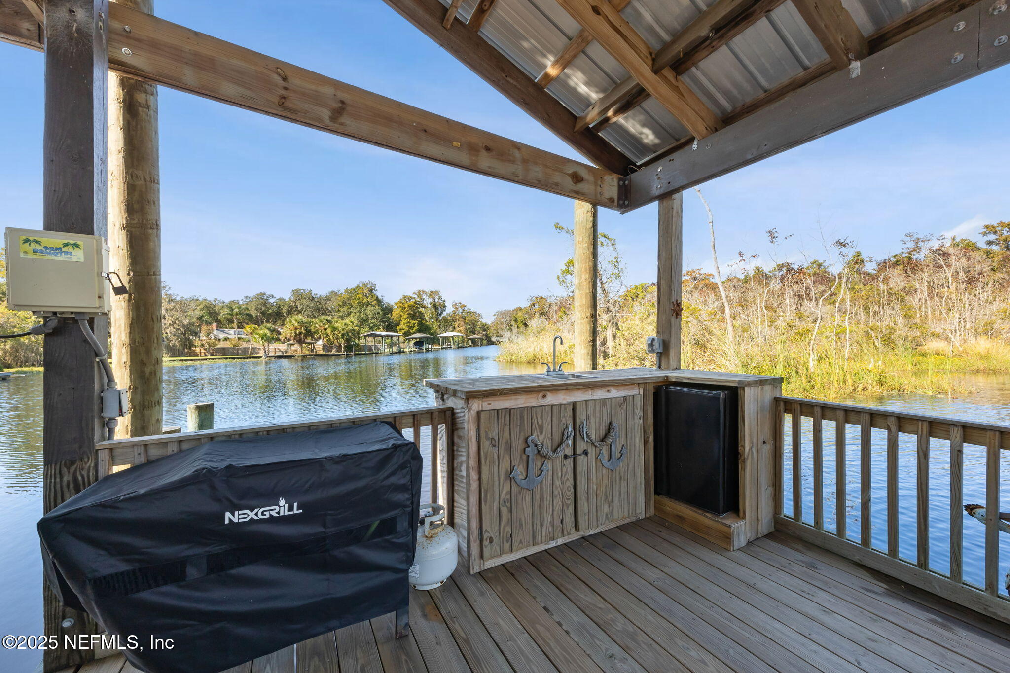 2245 Reed Street Orange Park, FL 32073 - Photo 66 of 107 a view of a balcony with furniture and a lake view