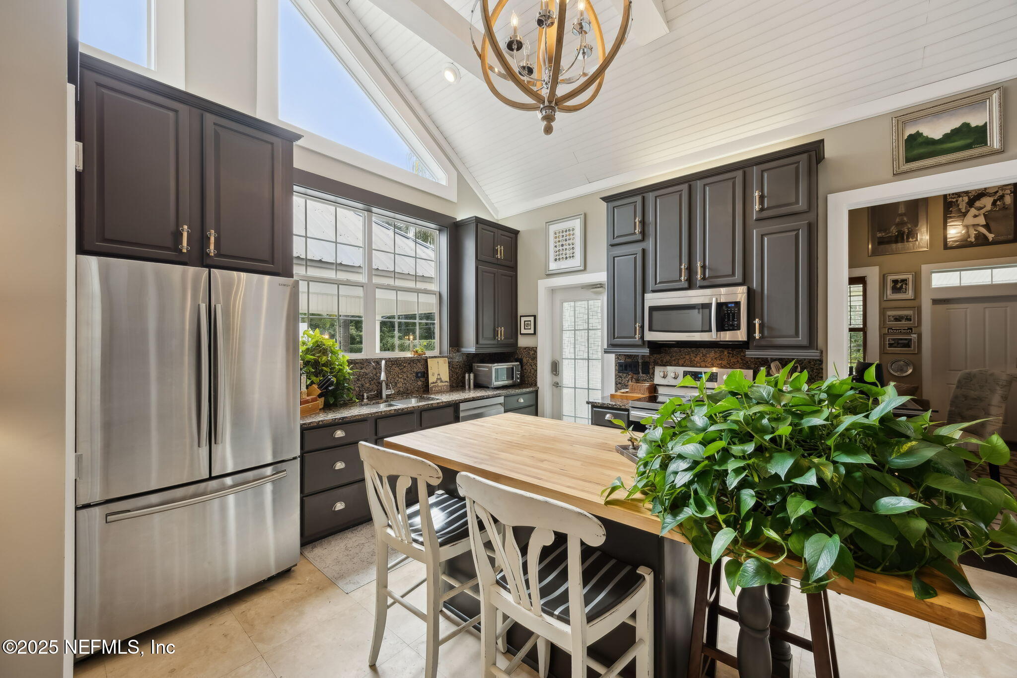 2245 Reed Street Orange Park, FL 32073 - Photo 78 of 107 a kitchen with stainless steel appliances a refrigerator a stove a microwave and dining table