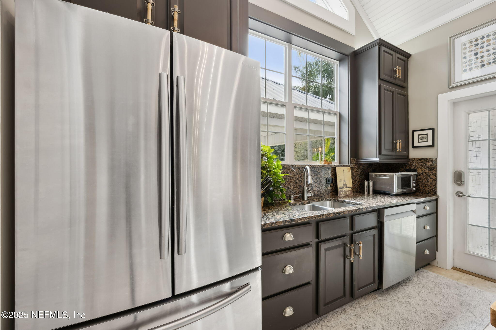 2245 Reed Street Orange Park, FL 32073 - Photo 79 of 107 a kitchen with appliances a sink and cabinets